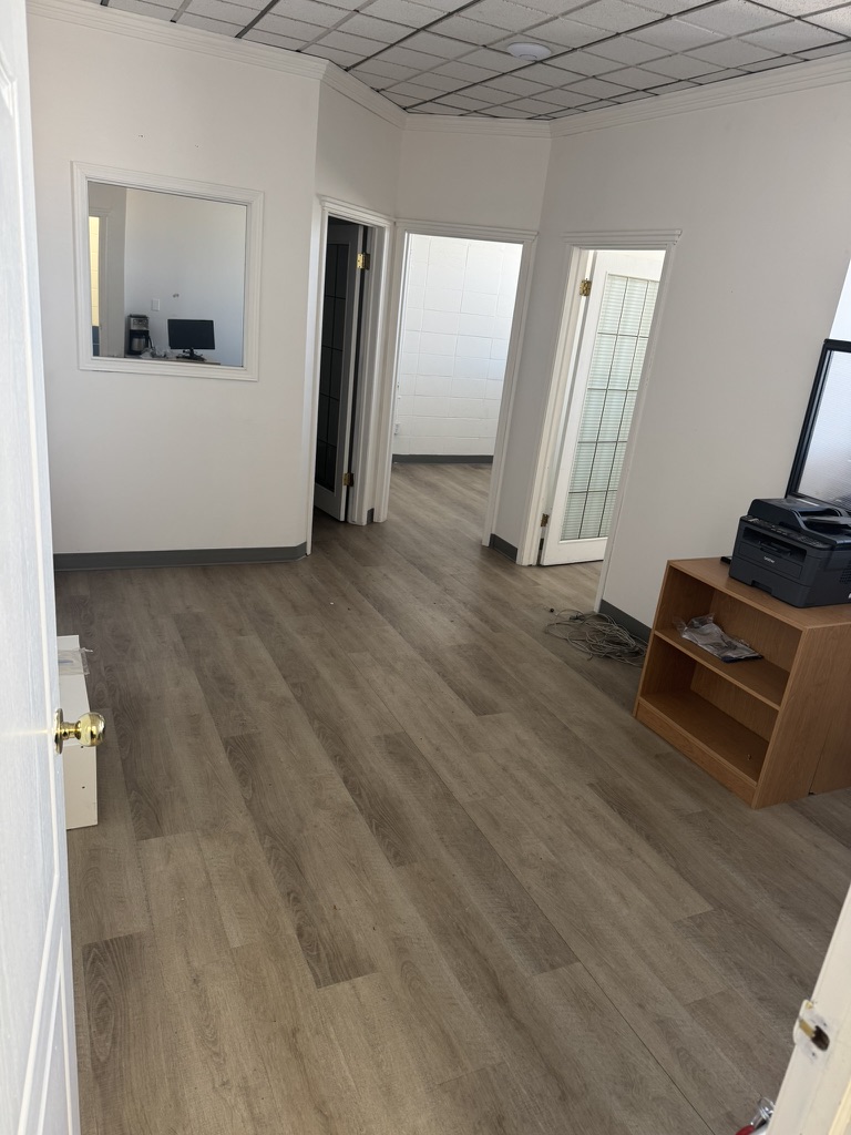 Private office interior with desk and natural light at The Corner Coworking River Ave location