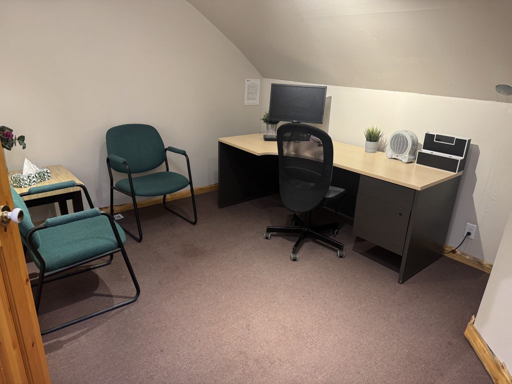 Day Office interior viewed through wooden beam doorway at The Corner Coworking Railway St